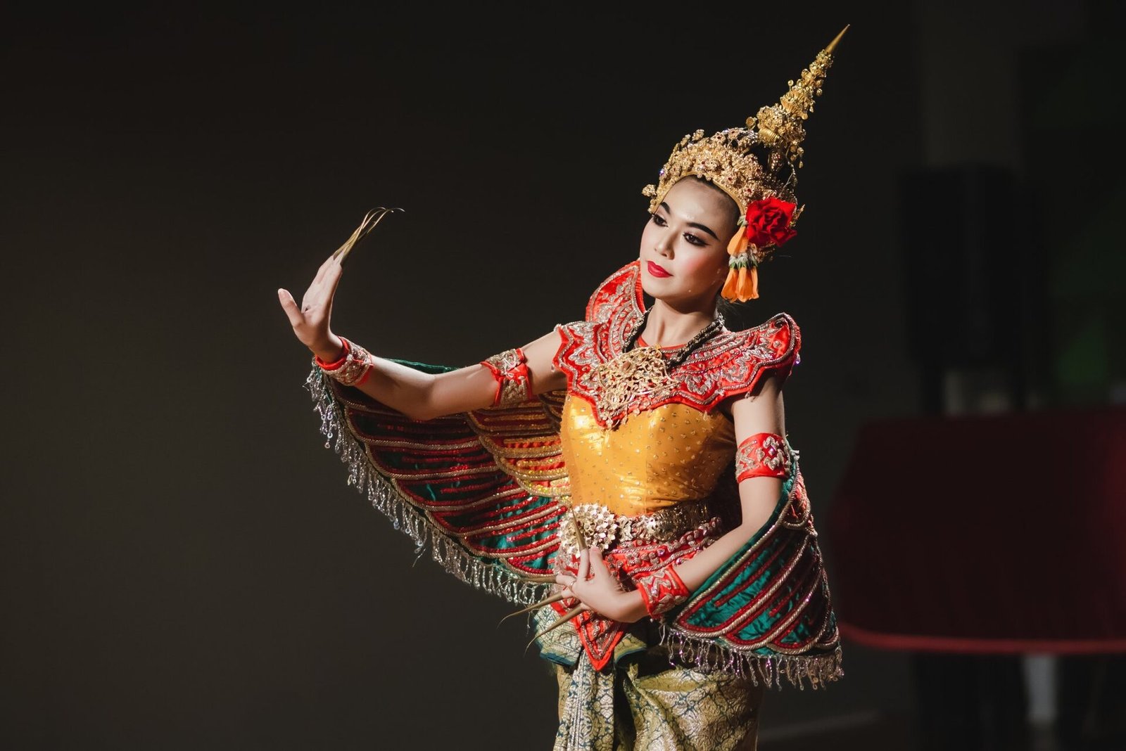 Classical Thai dancer in ornate Khon costume with golden headdress